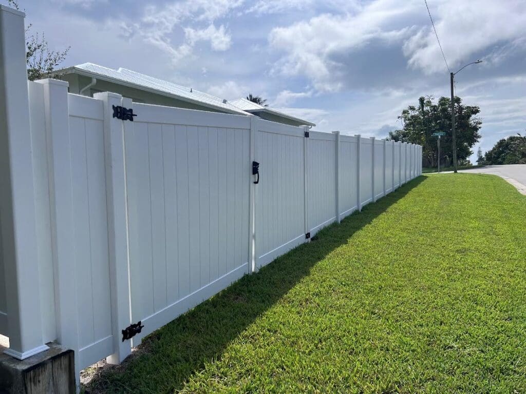 White vinyl fence with gate.