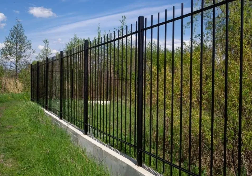 A fence that is made of metal.