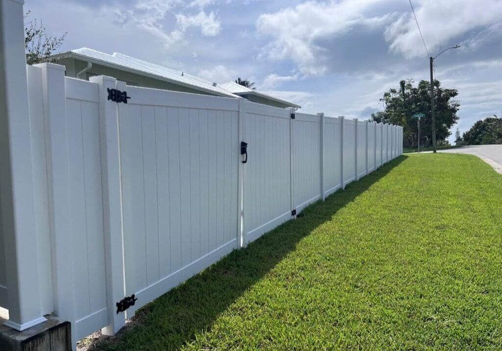 White vinyl fence with gate.